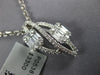 .73CT DIAMOND 18KT WHITE GOLD ROUND & BAGUETTE DOUBLE LEAF INFINITY LOVE PENDANT