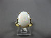 4.08CT DIAMOND & AAA OPAL 14KT 2 TONE GOLD CLASSIC OVAL & ROUND ENGAGEMENT RING