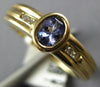 ESTATE .45CT DIAMOND & AAA TANZANITE 14KT YELLOW GOLD 3D OVAL & ROUND BEZEL RING