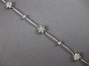 ESTATE .75CT DIAMOND 14KT WHITE GOLD FLOWER BY THE YARD CLASSIC TENNIS BRACELET
