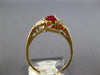 .77CT DIAMOND & AAA RUBY 14KT YELLOW GOLD MARQUISE & ROUND 3 STONE DIAGONAL RING