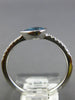 .65CT DIAMOND & AAA BLUE TOPAZ 14KT WHITE GOLD PEAR SHAPE & ROUND BEZEL FUN RING