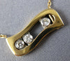 ESTATE .17CT DIAMOND 18KT WHITE & ROSE GOLD 3 STONE ETOILE FLOATING LOVE PENDANT