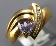 .60CT DIAMOND & TANZANITE 14KT YELLOW GOLD ROUND & TRILLION LOVE KNOT FUN RING