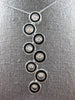 LARGE .85CT DANCING DIAMOND & BLACK ENAMEL 14K WHITE GOLD MULTI CIRCULAR PENDANT