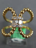 ESTATE LARGE .11CT DIAMOND 18KT ROSE GOLD 3D ROUND & BAGUETTE LOVE KNOT RING