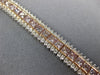 WIDE & LONG 12.26CT WHITE & PINK DIAMOND 18KT WHITE & ROSE GOLD TENNIS BRACELET