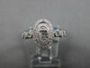 ESTATE .32CT DIAMOND 14KT WHITE GOLD ROUND & BAGUETTE OVAL DOUBLE HALO FUN RING
