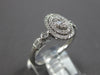 ESTATE .32CT DIAMOND 14KT WHITE GOLD ROUND & BAGUETTE OVAL DOUBLE HALO FUN RING
