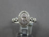 ESTATE .32CT DIAMOND 14KT WHITE GOLD ROUND & BAGUETTE OVAL DOUBLE HALO FUN RING