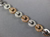 WIDE .97CT WHITE & PINK DIAMOND 18KT WHITE & ROSE GOLD CIRCULAR TENNIS BRACELET