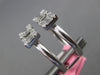 ESTATE .78CT DIAMOND 18KT WHITE GOLD 3D ROUND & BAGUETTE SQUARE TENSION FUN RING