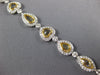 LARGE 13.95CT WHITE & CANARY DIAMOND 18KT 2 TONE GOLD HALO LOVE TENNIS BRACELET