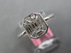.56CT DIAMOND 18KT WHITE GOLD BAGUETTE INVISIBLE OCTAGON BEZEL ENGAGEMENT RING
