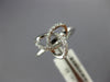 ESTATE .13CT DIAMOND 18KT WHITE GOLD 3D CLASSIC LOVE KNOT FLOWER STAR RING