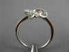 ESTATE .13CT DIAMOND 18KT WHITE GOLD 3D CLASSIC LOVE KNOT FLOWER STAR RING