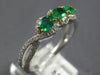 .87CT DIAMOND & AAA EMERALD 18KT 2 TONE GOLD ROUND & OVAL 3 STONE INFINITY RING