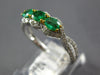 .87CT DIAMOND & AAA EMERALD 18KT 2 TONE GOLD ROUND & OVAL 3 STONE INFINITY RING