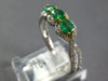 .87CT DIAMOND & AAA EMERALD 18KT 2 TONE GOLD ROUND & OVAL 3 STONE INFINITY RING