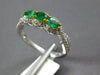 .87CT DIAMOND & AAA EMERALD 18KT 2 TONE GOLD ROUND & OVAL 3 STONE INFINITY RING