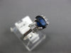 1.18CT DIAMOND & AAA SAPPHIRE 18K WHITE GOLD OVAL & BAGUETTE BOW ENGAGEMENT RING