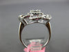 .93CT DIAMOND 18K WHITE GOLD ROUND & BAGUETTE CLUSTER INVISIBLE FLOWER LOVE RING