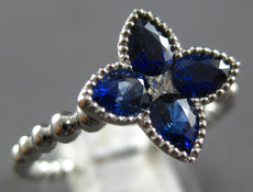 1.03CT DIAMOND & AAA SAPPHIRE 18KT WHITE GOLD PRINCESS & PEAR SHAPE FLOWER RING