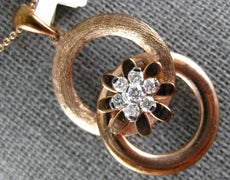 ESTATE .19CT DIAMOND 18KT ROSE GOLD 3D FLOWER CIRCULAR LOVE KNOT FUN PENDANT