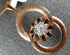 ESTATE .19CT DIAMOND 18KT ROSE GOLD 3D FLOWER CIRCULAR LOVE KNOT FUN PENDANT