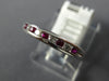 .27CT DIAMOND & AAA RUBY 18KT WHITE GOLD CLASSIC ROUND CHANNEL ANNIVERSARY RING
