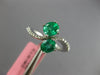 1.33CT DIAMOND & AAA EMERALD 18KT WHITE GOLD OVAL CRISS CROSS INFINITY LOVE RING