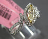 .64CT WHITE & FANCY YELLOW DIAMOND 18KT 2 TONE GOLD MARQUISE & ROUND LEAF RING