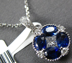1.62CT DIAMOND & AAA SAPPHIRE 18KT WHITE GOLD OVAL & PRINCESS CUT FLOWER PENDANT