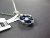 1.62CT DIAMOND & AAA SAPPHIRE 18KT WHITE GOLD OVAL & PRINCESS CUT FLOWER PENDANT