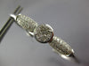 ESTATE .62CT DIAMOND 14KT WHITE GOLD ROUND & BAGUETTE INVISIBLE BANGLE BRACELET