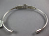 ESTATE .62CT DIAMOND 14KT WHITE GOLD ROUND & BAGUETTE INVISIBLE BANGLE BRACELET