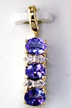 1.06CT DIAMOND & AAA TANZANITE 14KT YELLOW GOLD 3D OVAL & ROUND 3 STONE PENDANT