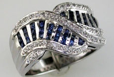1.06CT DIAMOND & AAA SAPPHIRE 14KT WHITE GOLD ROUND & PRINCESS CRISS CROSS RING